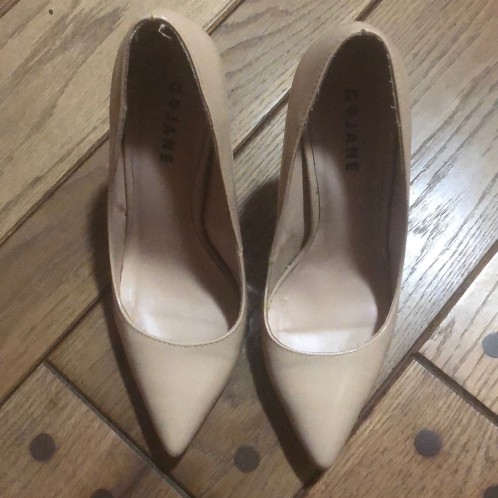 Nude patent pumps